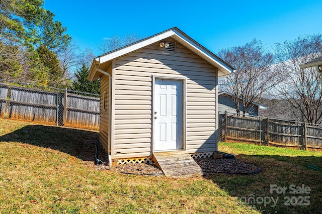 view of shed featuring a fenced backyard