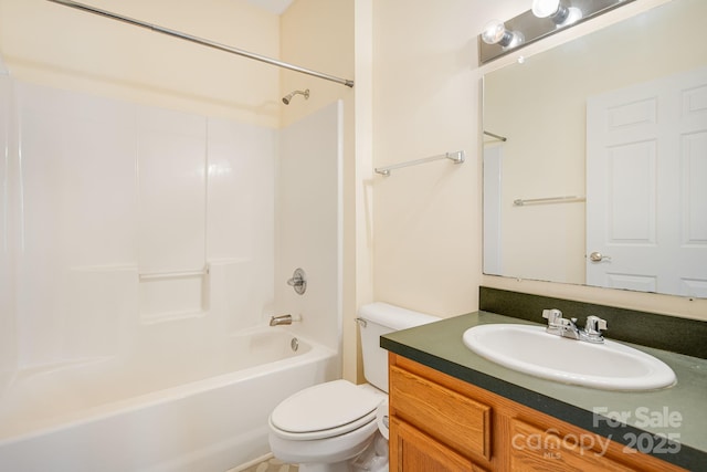 bathroom featuring tub / shower combination, vanity, and toilet