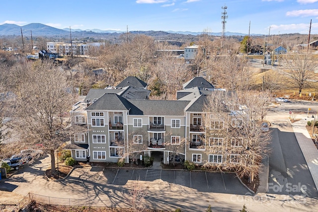 birds eye view of property with a mountain view