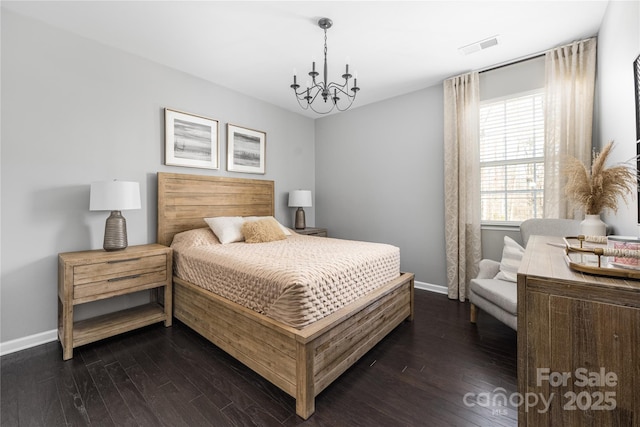 bedroom with dark wood-style floors, a chandelier, visible vents, and baseboards