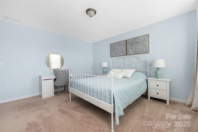 bedroom with carpet, visible vents, and baseboards