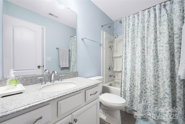 full bathroom featuring visible vents, toilet, tile patterned floors, shower / bath combo with shower curtain, and vanity