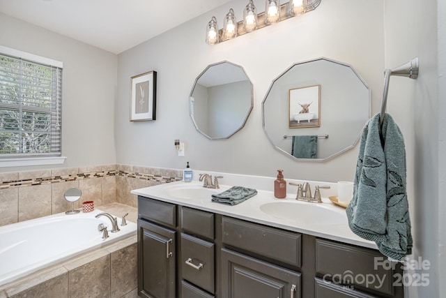 full bathroom with a garden tub, a sink, and double vanity