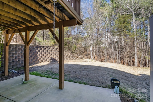 view of patio featuring fence