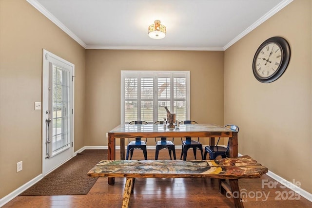 dining area featuring baseboards, dark wood-type flooring, and ornamental molding