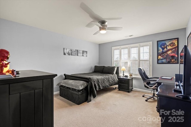 bedroom with visible vents, light colored carpet, a ceiling fan, and baseboards