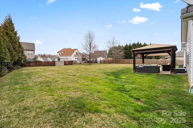 view of yard with an outdoor living space, a patio, a gazebo, and a fenced backyard