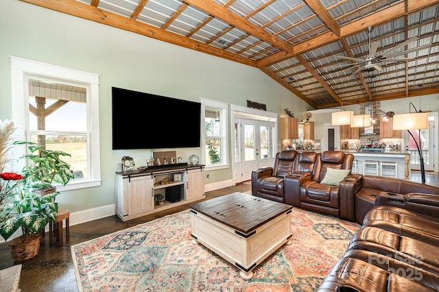 living room with french doors, ceiling fan, high vaulted ceiling, concrete flooring, and baseboards