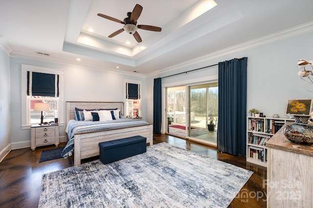 bedroom featuring visible vents, baseboards, access to outside, ornamental molding, and a tray ceiling