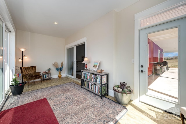 sitting room with recessed lighting and baseboards