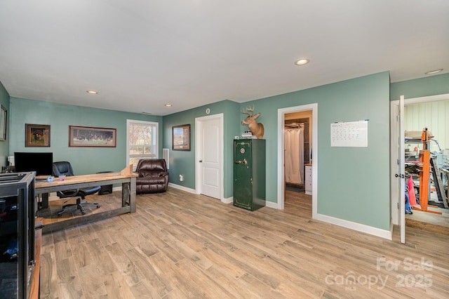 home office with light wood finished floors, baseboards, and recessed lighting