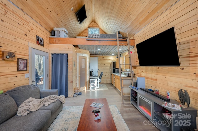 living area with high vaulted ceiling, light wood finished floors, wood ceiling, and wooden walls