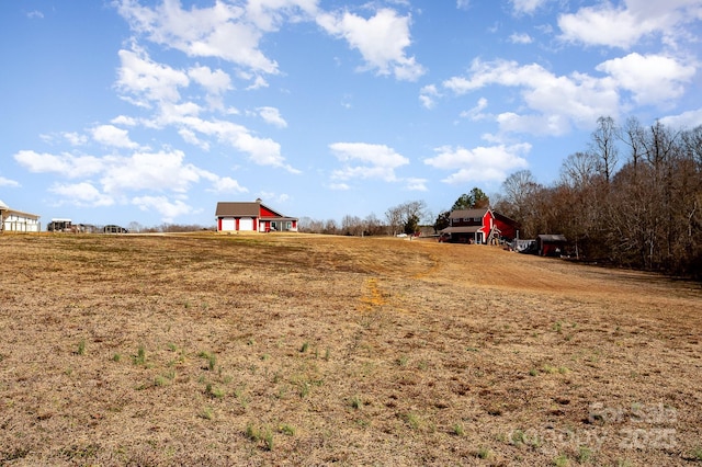 view of yard with a rural view