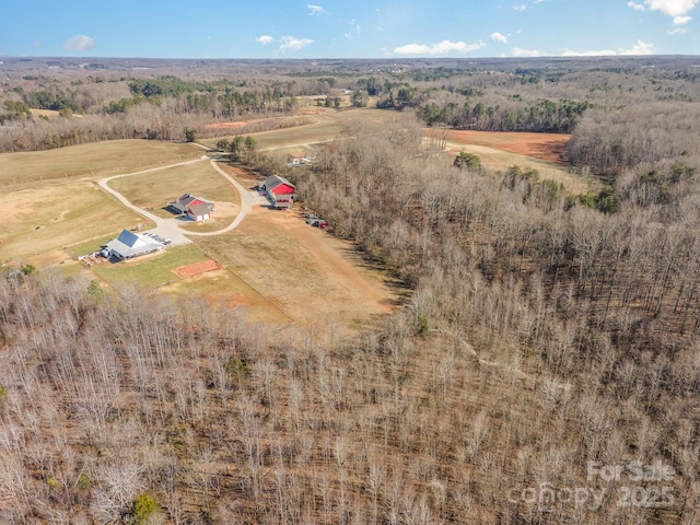 birds eye view of property featuring a rural view