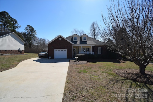 view of front of house featuring a front lawn, covered porch, driveway, and an attached garage