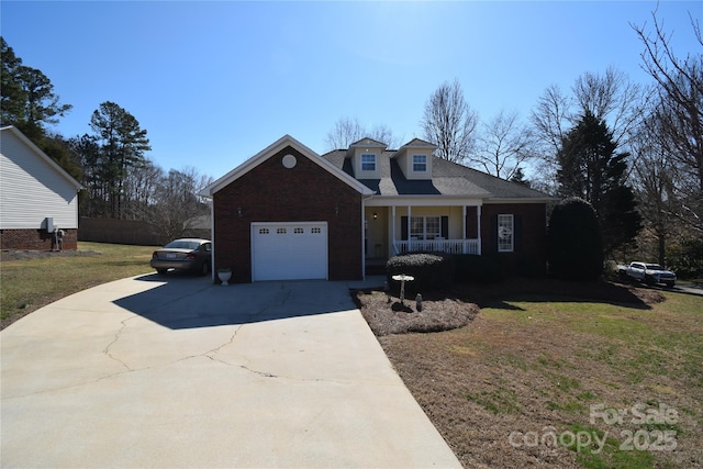 view of front facade featuring a porch, an attached garage, fence, concrete driveway, and a front lawn