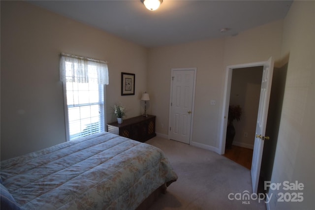 carpeted bedroom with baseboards