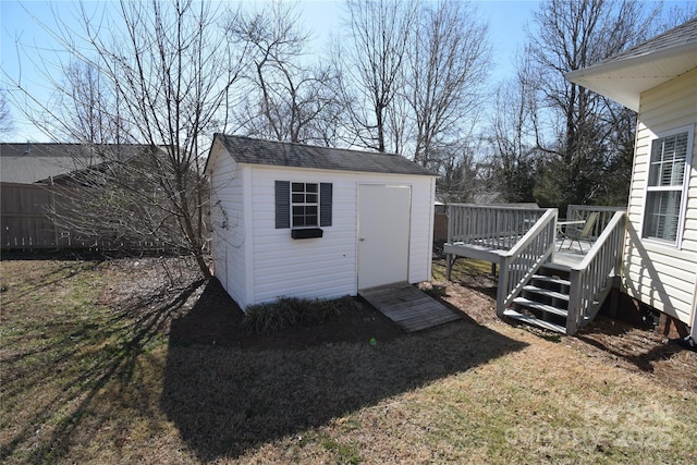 view of shed featuring fence