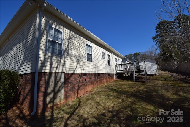 view of home's exterior with crawl space, a deck, and a yard