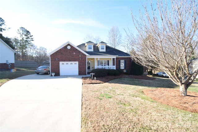 view of front of home with driveway, covered porch, a front lawn, and brick siding