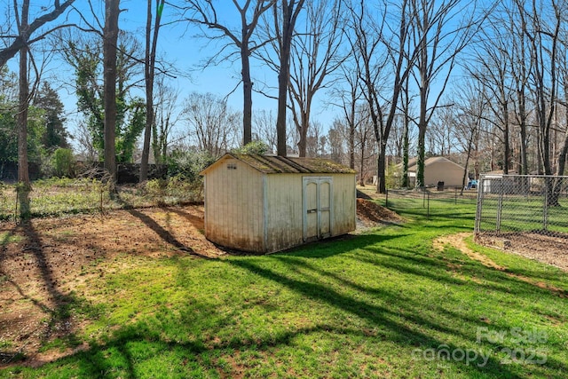 view of shed with fence