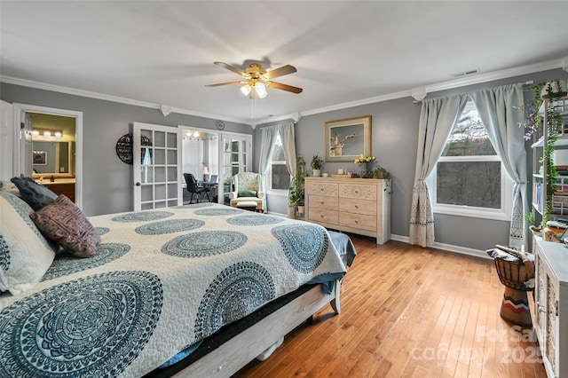 bedroom featuring baseboards, visible vents, ornamental molding, french doors, and light wood-style floors