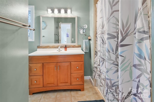 bathroom featuring a shower with curtain, backsplash, vanity, and tile patterned floors