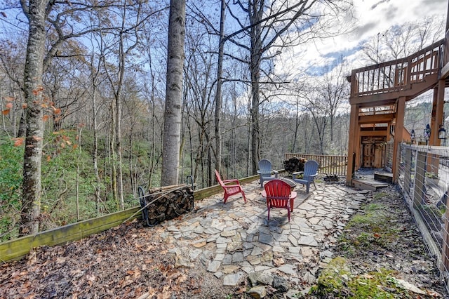 view of yard with a fire pit and a patio area