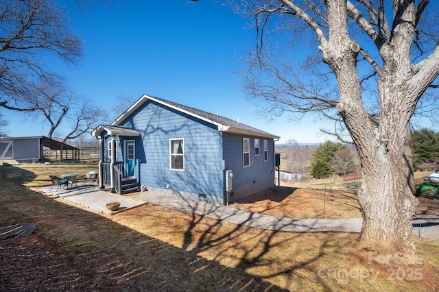 view of home's exterior featuring crawl space