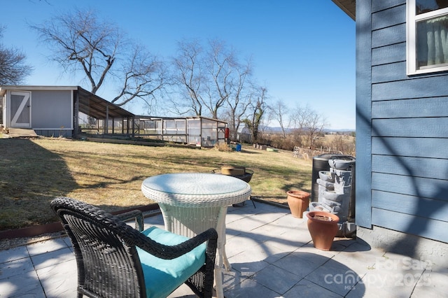 view of patio featuring an outdoor structure