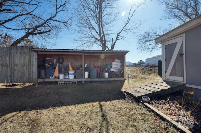 view of shed with fence