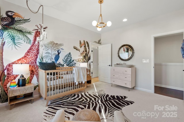 bedroom with baseboards, recessed lighting, light colored carpet, and an inviting chandelier