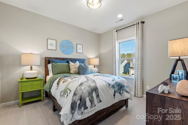 bedroom with baseboards, visible vents, and light colored carpet