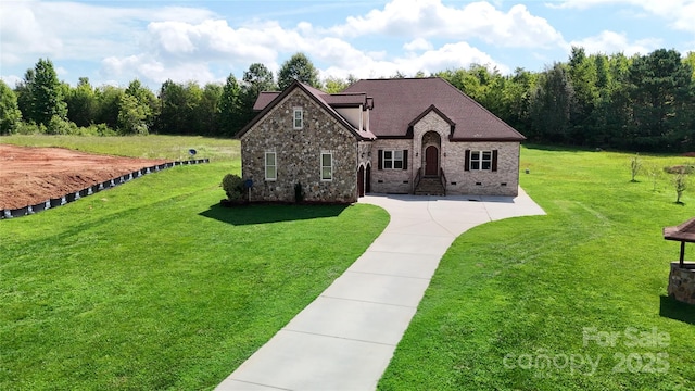 view of front of home featuring crawl space, brick siding, a front lawn, and roof with shingles