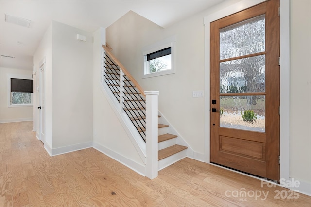 200 Stafford St, Black Mountain, NC 28711 - entrance foyer with stairway, light wood-style flooring, and baseboards