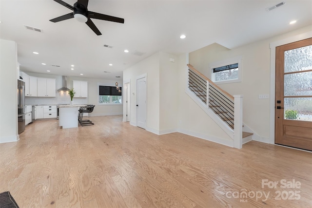200 Stafford St, Black Mountain, NC 28711 - unfurnished living room with stairway, light wood-style flooring, visible vents, and recessed lighting