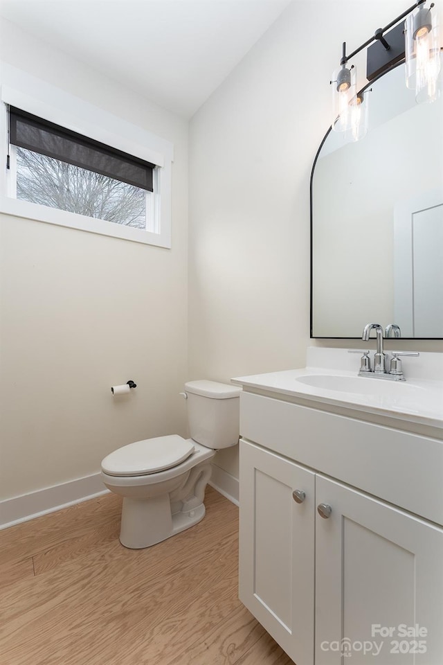 200 Stafford St, Black Mountain, NC 28711 - bathroom with toilet, baseboards, wood finished floors, and vanity