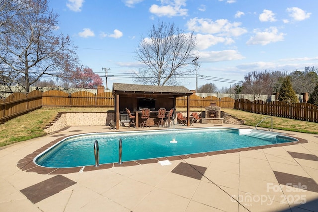 view of swimming pool with a patio area, a fenced backyard, outdoor dry bar, and a fenced in pool