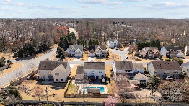 bird's eye view with a forest view and a residential view