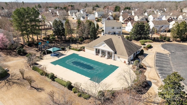 view of pool with a patio, fence, a residential view, and a fenced in pool