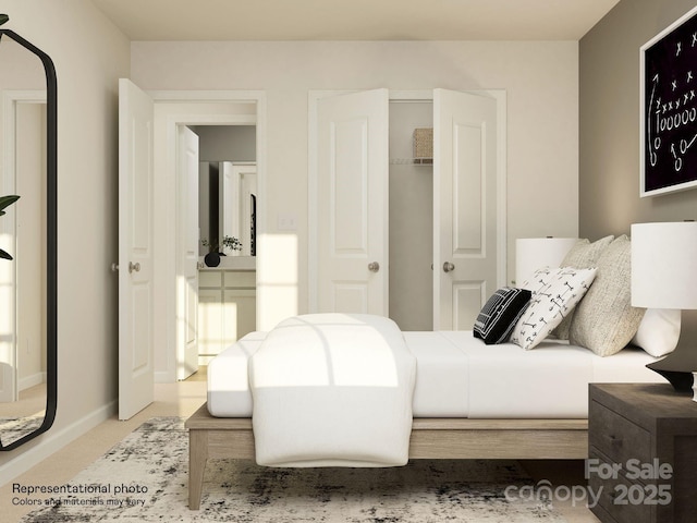 carpeted bedroom featuring a closet and baseboards