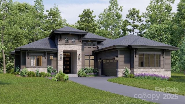 prairie-style house with a garage, stone siding, a front lawn, and concrete driveway