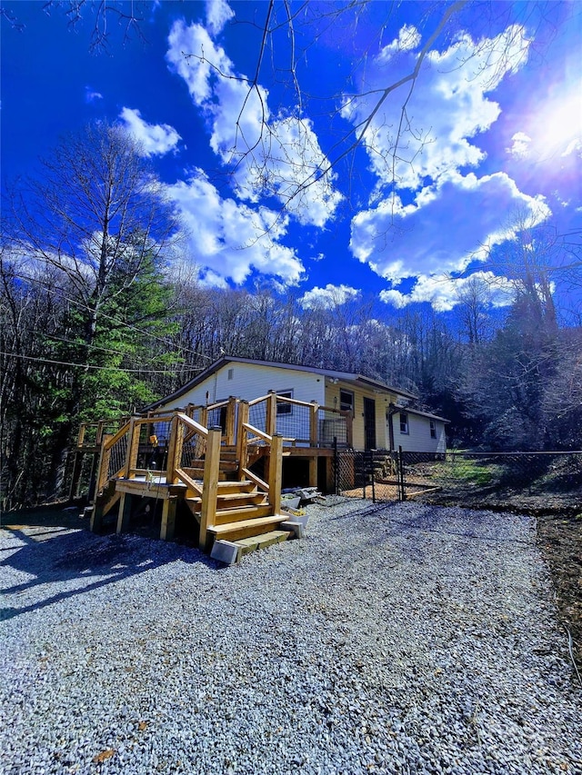 view of front facade with a wooden deck