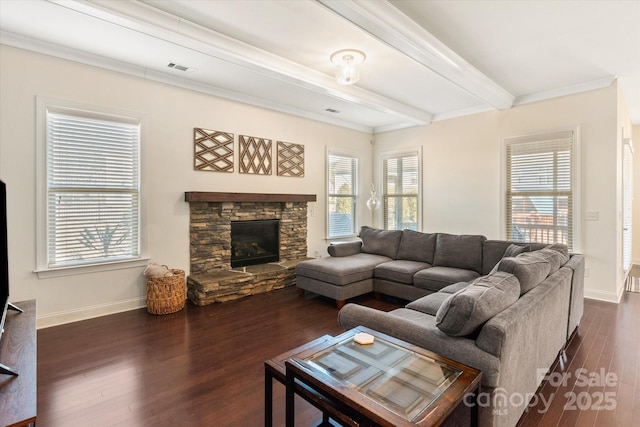 living area with visible vents, baseboards, dark wood-type flooring, a fireplace, and beam ceiling