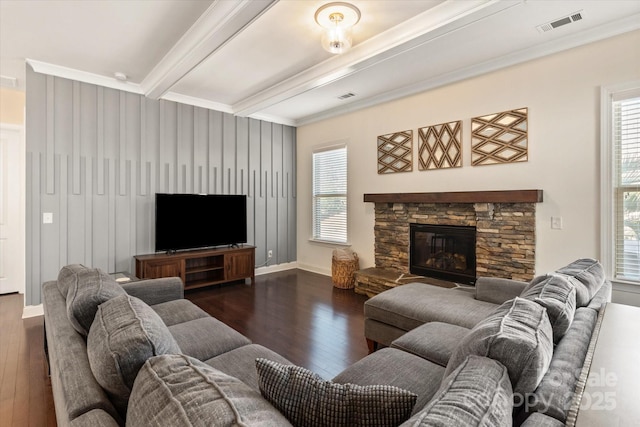 living room featuring visible vents, dark wood finished floors, beam ceiling, and crown molding