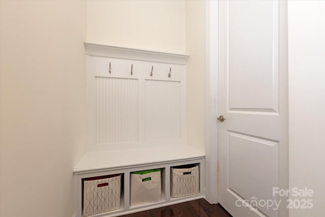 mudroom with dark wood-style floors