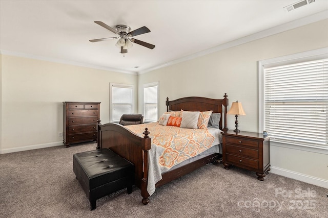 bedroom with ornamental molding, carpet, visible vents, and baseboards