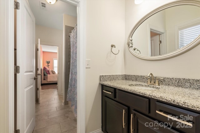 bathroom featuring vanity and visible vents