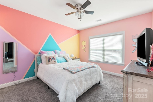 bedroom with carpet floors, baseboards, visible vents, and a ceiling fan