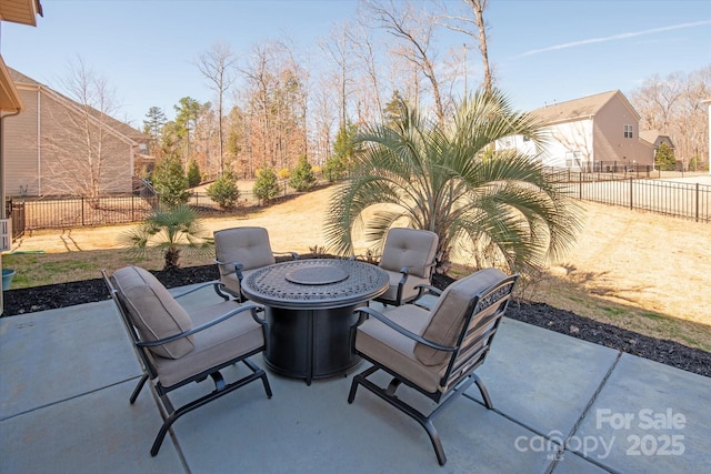 view of patio featuring a fenced backyard and outdoor dining area